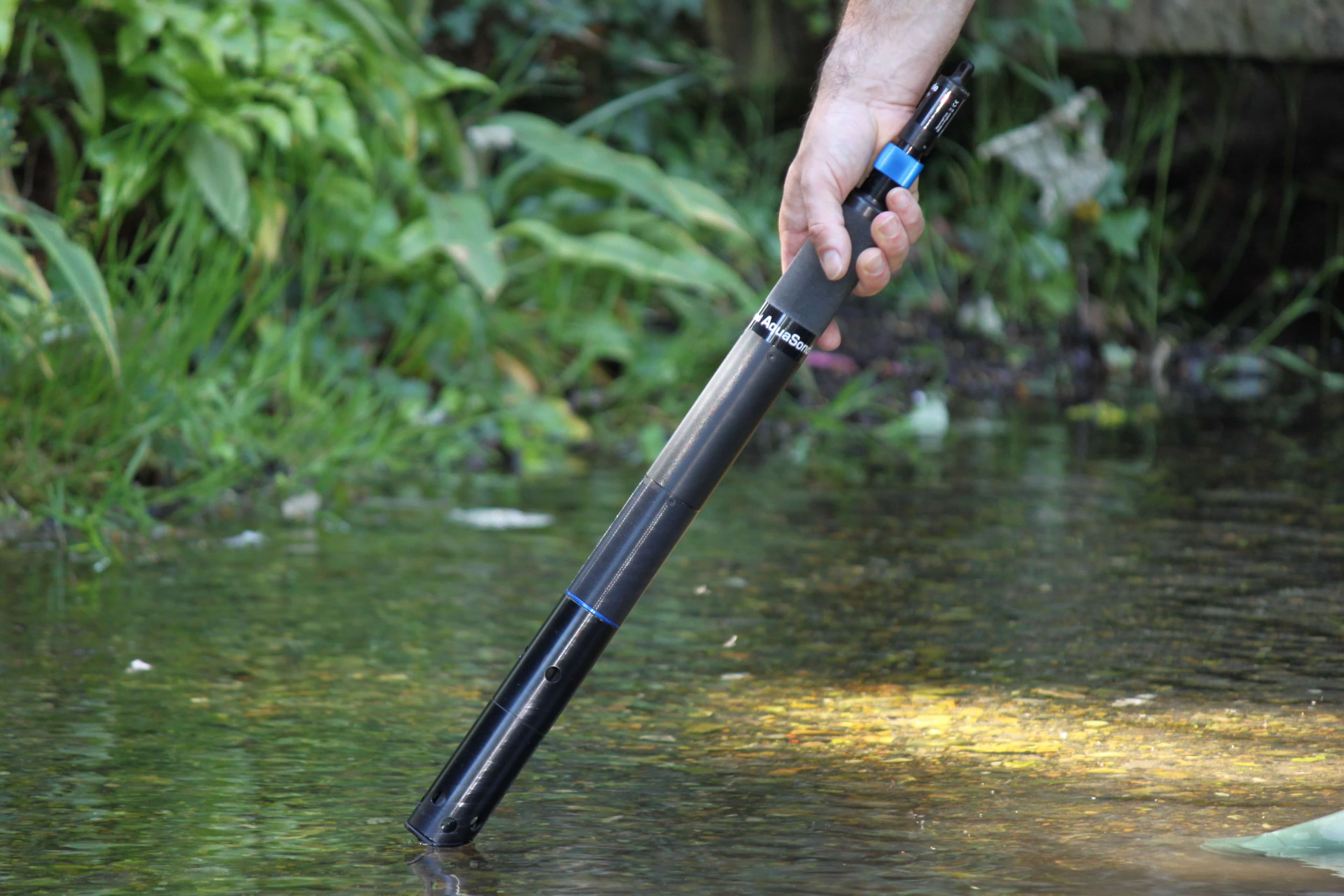 Water quality sonde being deployed in a river